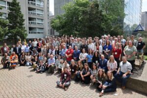 Summit attendees gather in the courtyard of the Delta Hotel