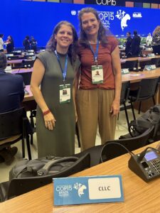 CMS COP15, Brazil - CLLC's Fernanda Teixeira And Katie Deuel in the Plenary Hall. CLLC photo.