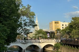 A view of the Cali River from the public “Green Zone” and the Iglesia La Ermita Church constructed from 1930-1948 in the background - CLLC/Aaron Laur