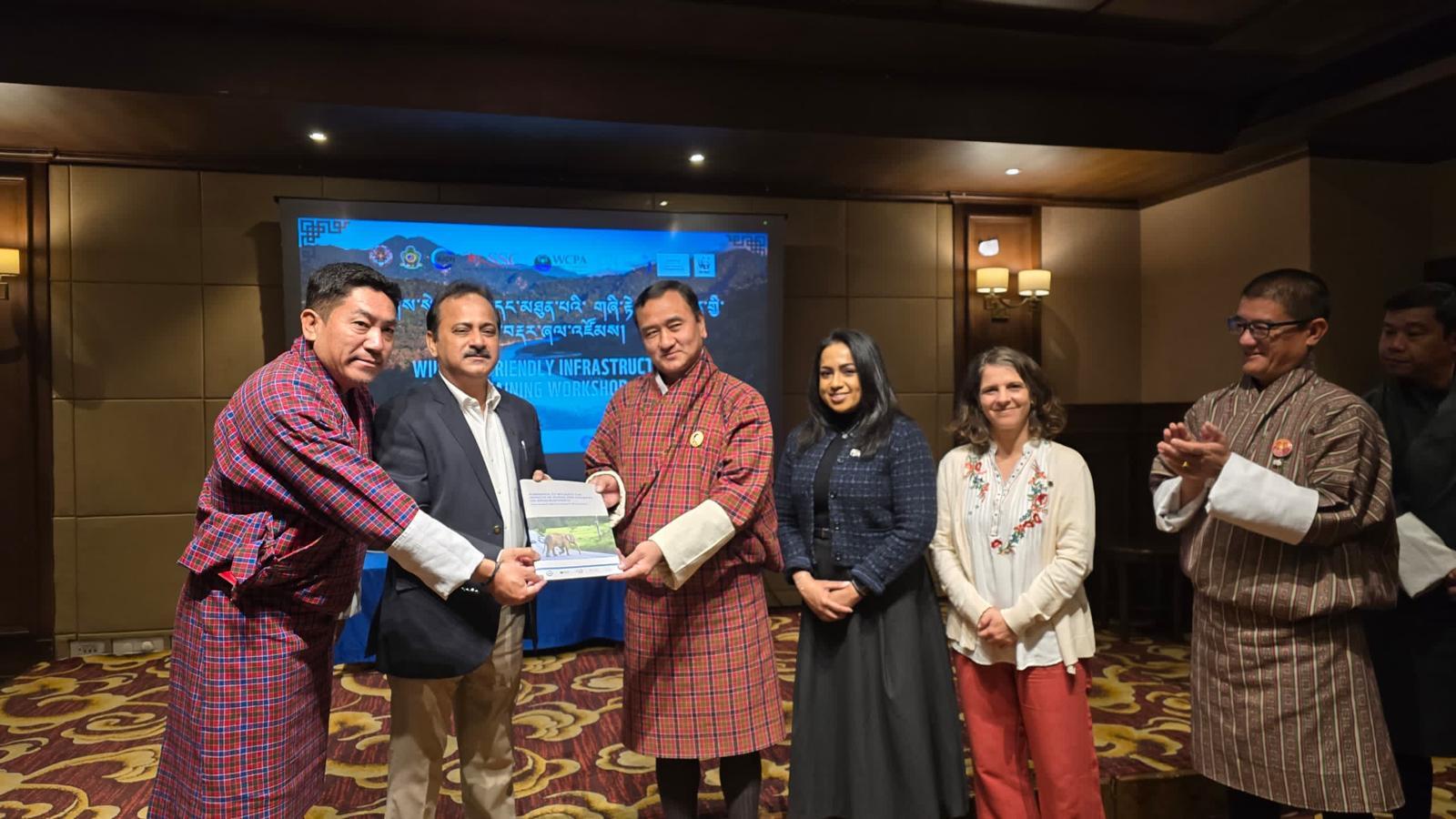 Asian Elephant Transport Working Group representatives providing a printed copy of the Handbook to the Bhutan Department of Forests and Park Service. Photo courtesy of Fernanda Teixeira